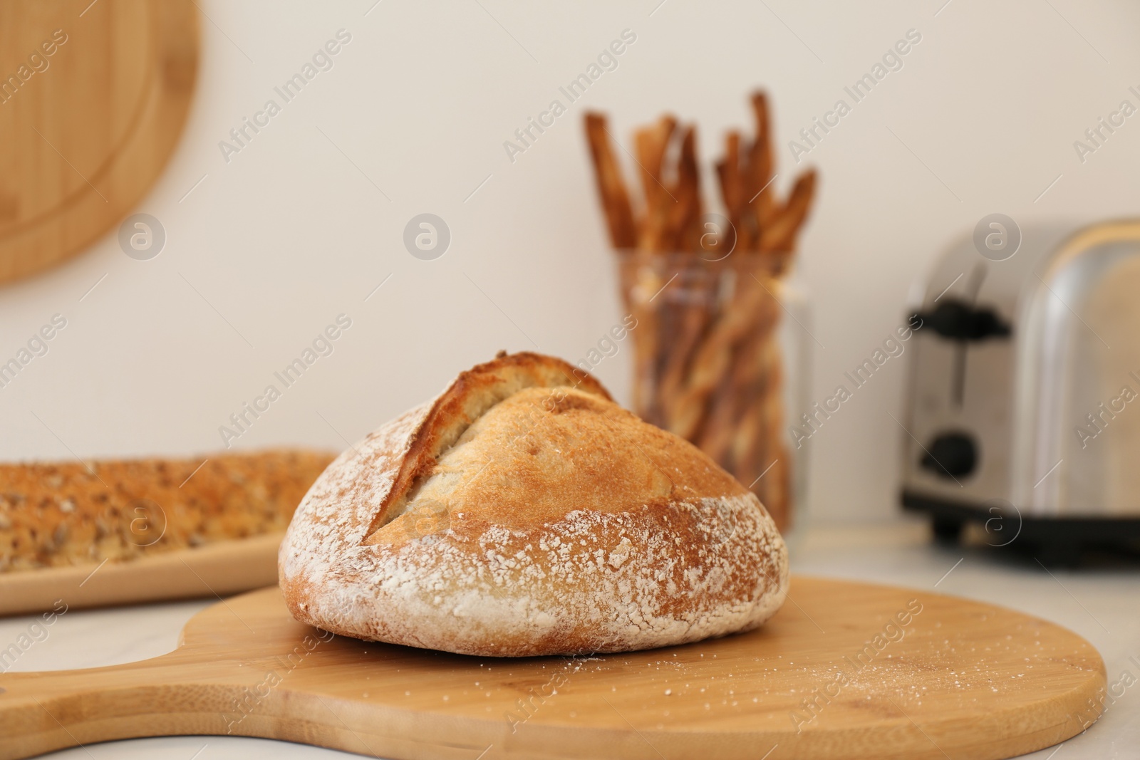 Photo of Loaf of bread on counter in kitchen, closeup