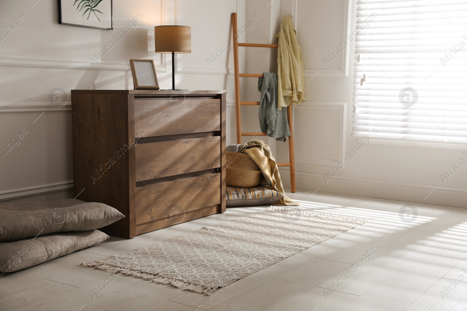 Photo of Stylish rug with pattern on floor in room