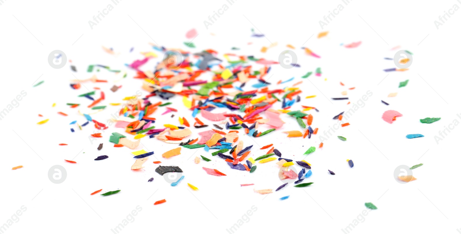 Photo of Colorful graphite crumbs on white background. Pencil sharpening