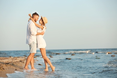 Young couple spending time together on beach