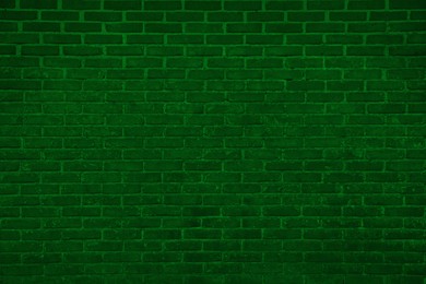 Texture of dark green brick wall as background