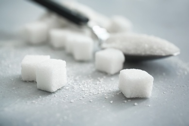 Photo of Refined sugar on gray background