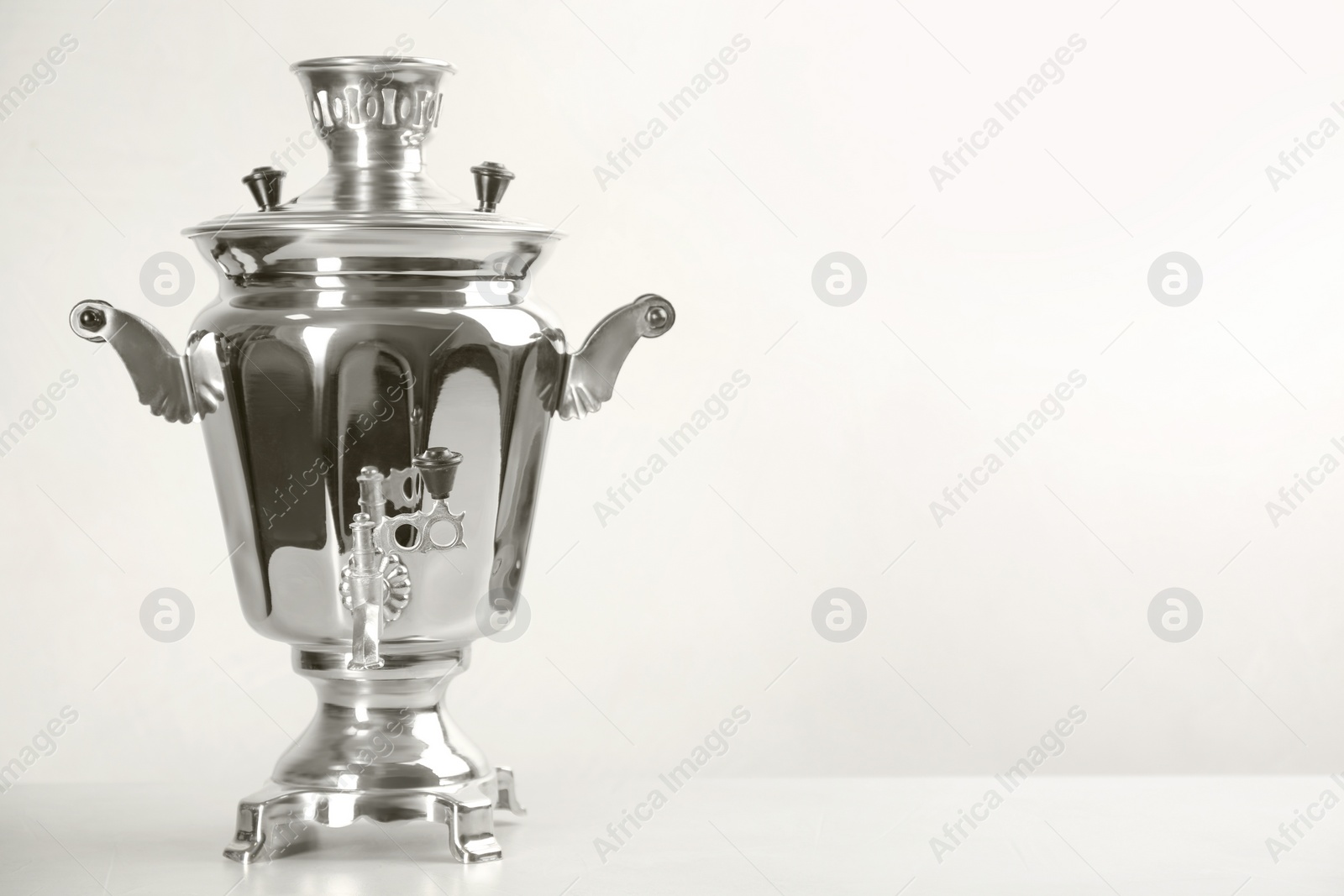 Photo of Traditional Russian samovar on white background. Space for text