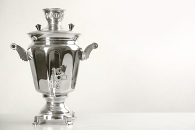Photo of Traditional Russian samovar on white background. Space for text