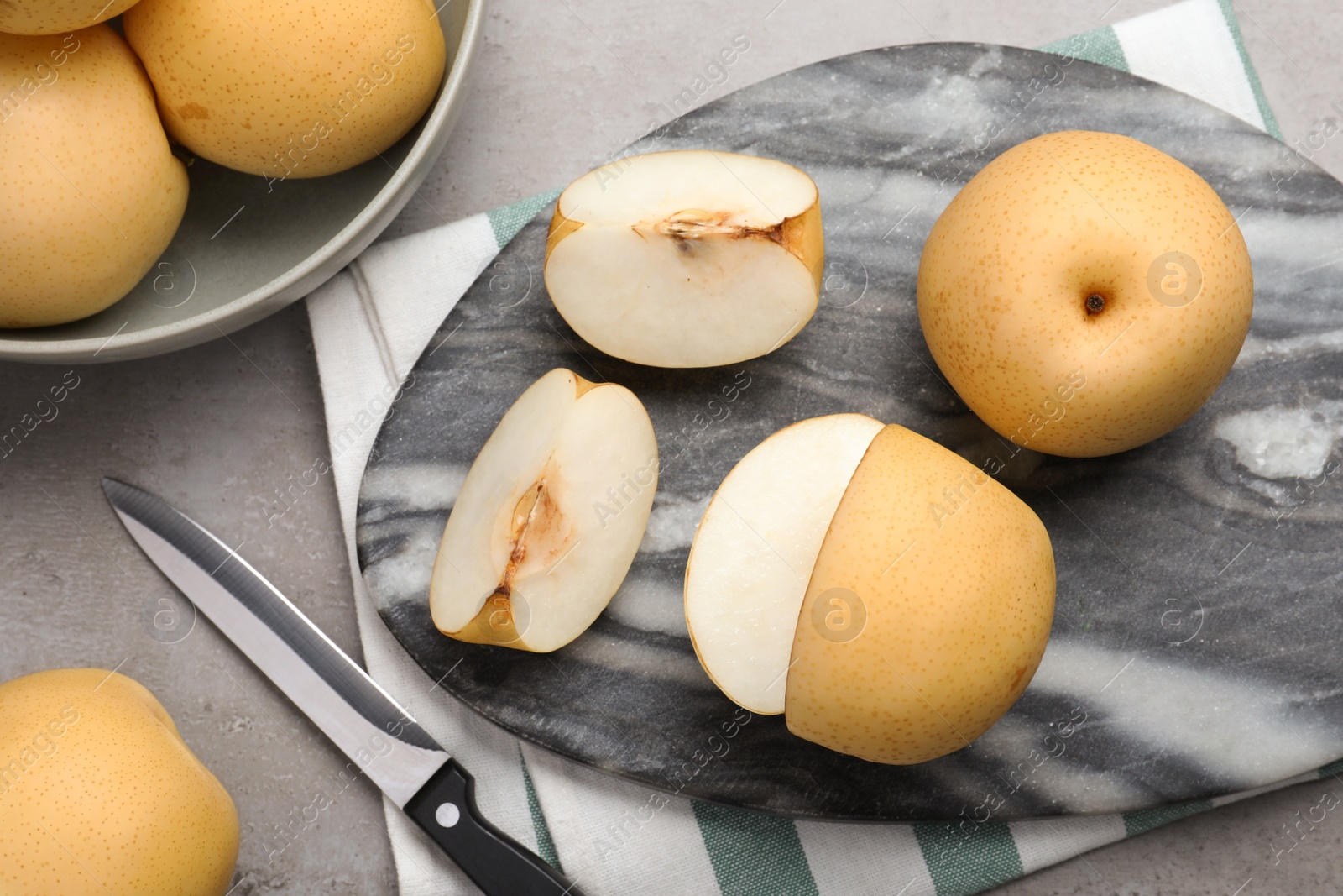 Photo of Fresh apple pears on grey table, flat lay