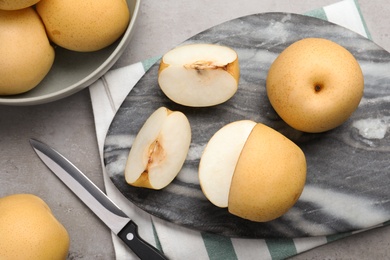 Photo of Fresh apple pears on grey table, flat lay