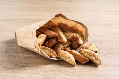 Photo of Traditional Italian almond biscuits (Cantucci) on wooden table