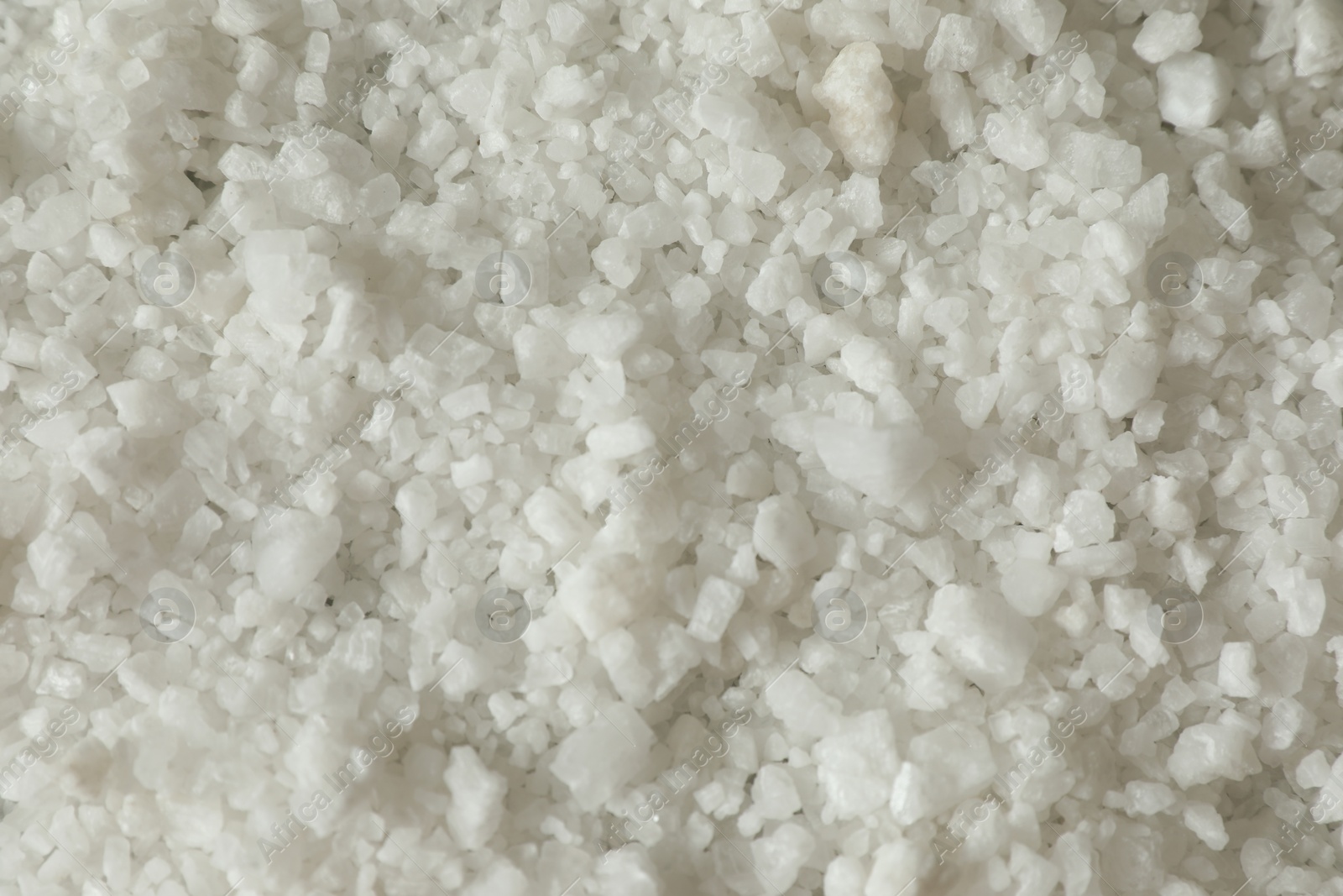 Photo of Organic sea salt as background, top view