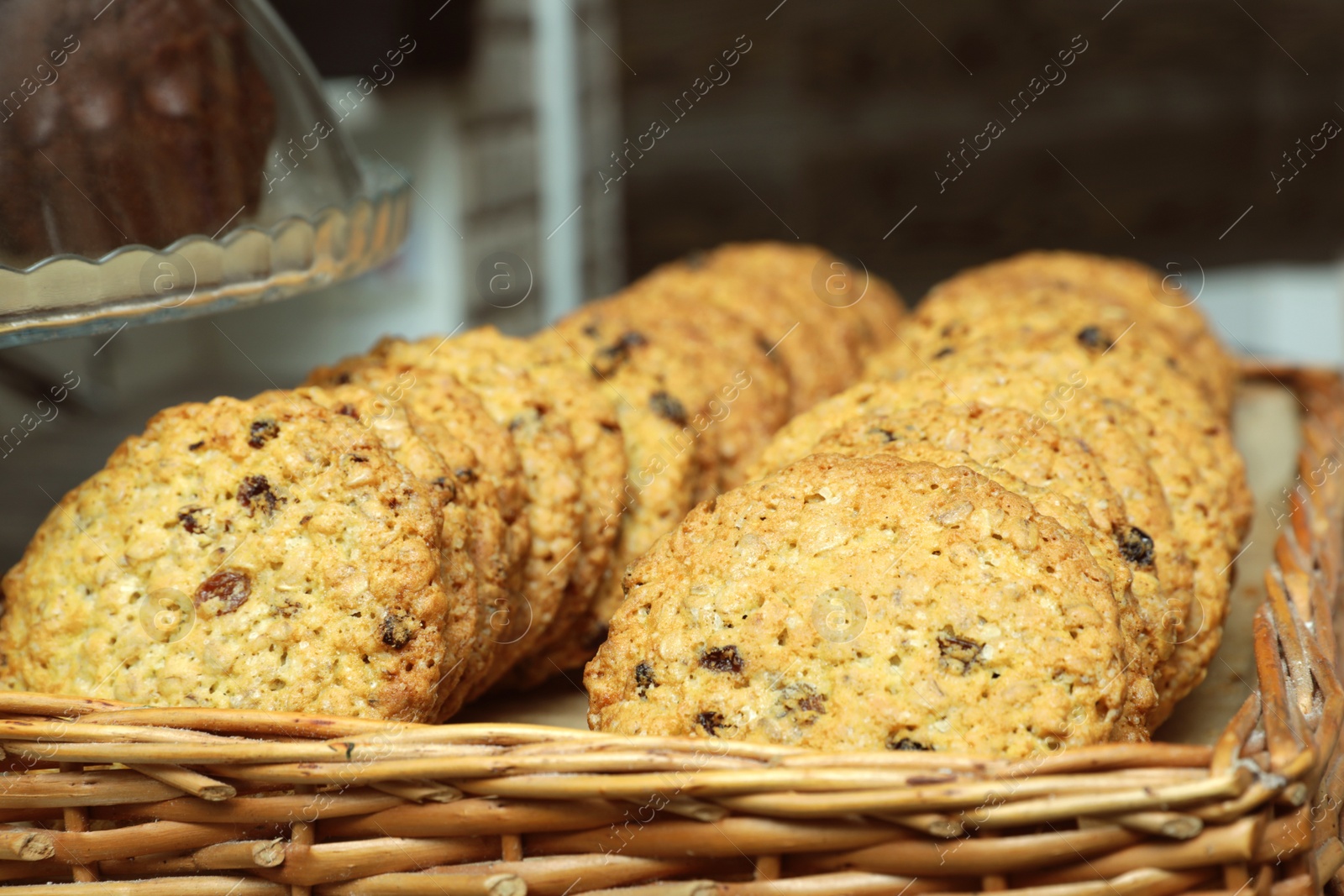 Photo of Wicker tray with fresh cookies in bakery