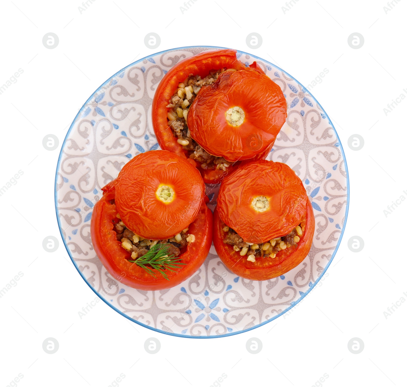 Photo of Plate of delicious stuffed tomatoes isolated on white, top view