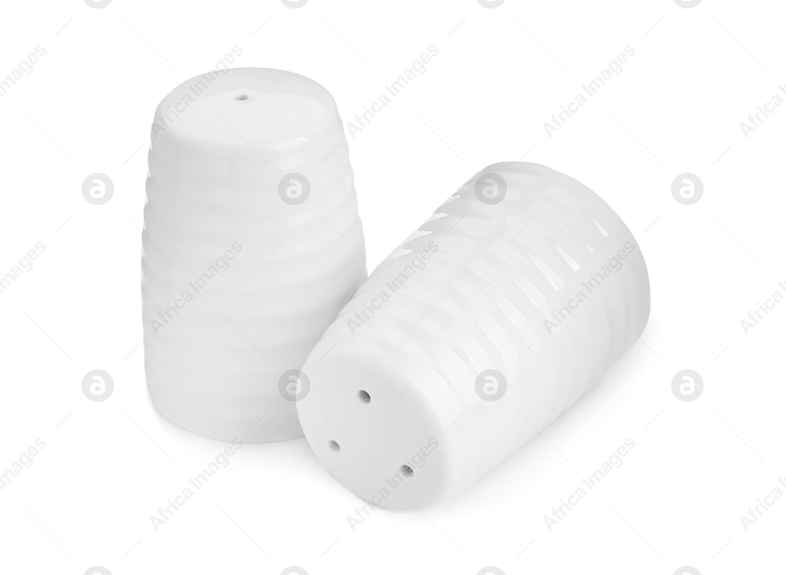 Photo of Ceramic salt and pepper shakers isolated on white