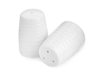 Photo of Ceramic salt and pepper shakers isolated on white