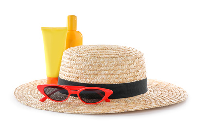 Sun protection products, sunglasses and hat on white background. Beach objects