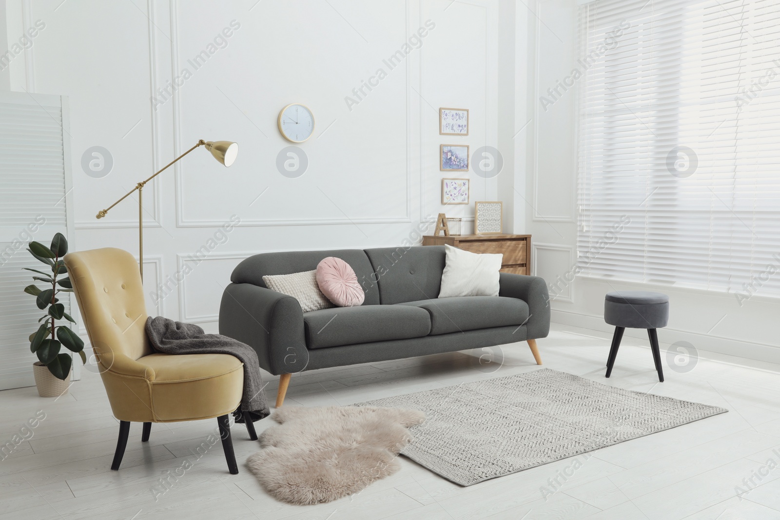 Photo of Comfortable sofa in modern living room. Interior design