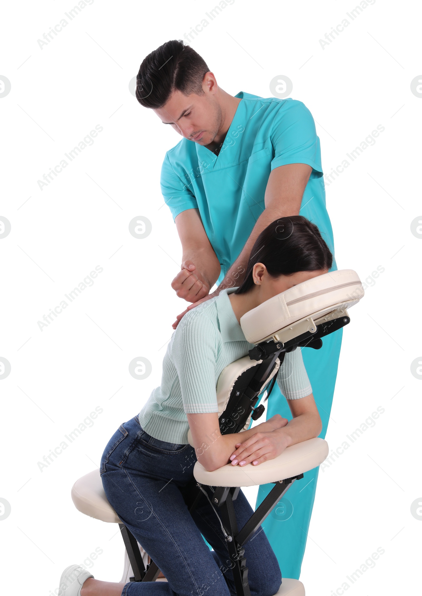 Photo of Woman receiving massage in modern chair on white background