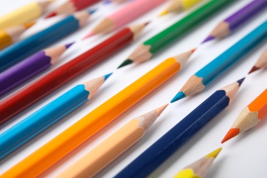 Photo of Composition with color pencils on white background, closeup