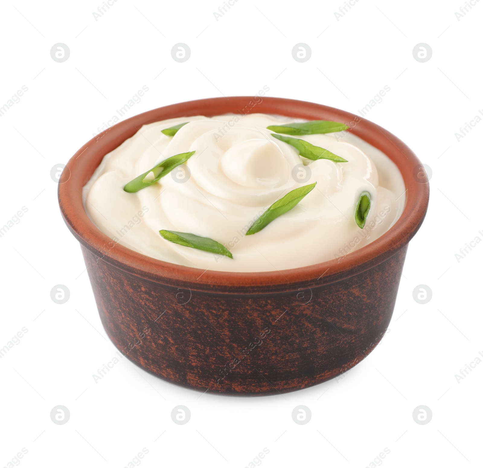 Photo of Mayonnaise with green onion in bowl isolated on white