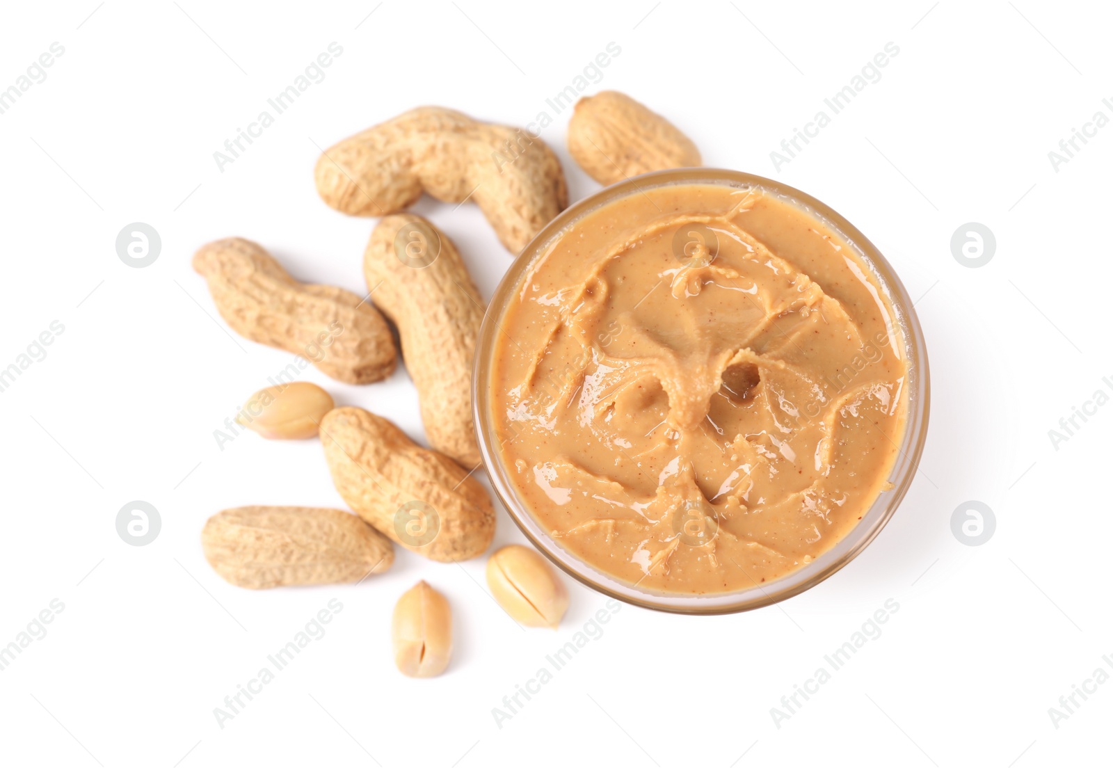 Photo of Delicious nut butter and peanuts isolated on white, top view