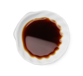 Photo of Tasty soy sauce in bowl isolated on white, top view