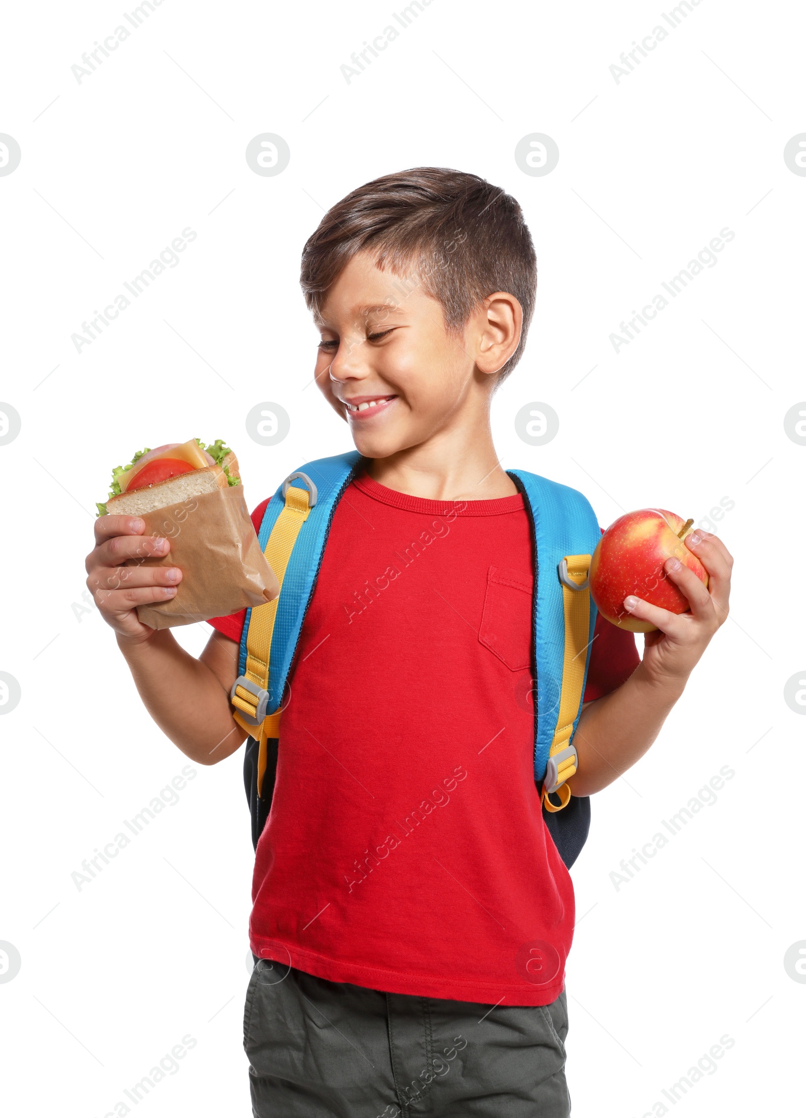 Photo of Schoolboy with healthy food and backpack on white background