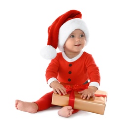 Photo of Festively dressed baby with gift box on white background. Christmas celebration