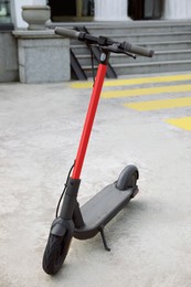 Photo of Modern electric scooter on city street. Rental service