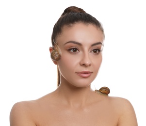 Photo of Beautiful young woman with snails on her body against white background