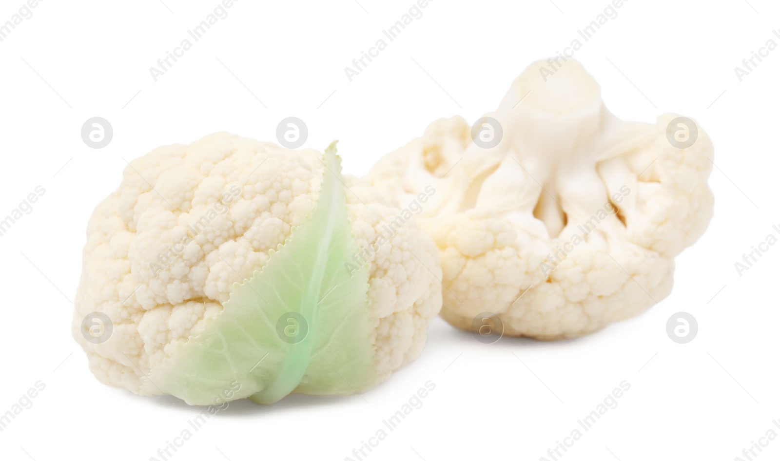 Photo of Cut fresh raw cauliflowers on white background