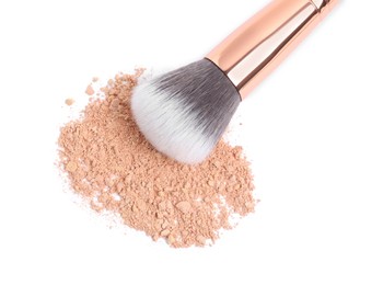 Photo of Loose face powder and makeup brush on white background, top view
