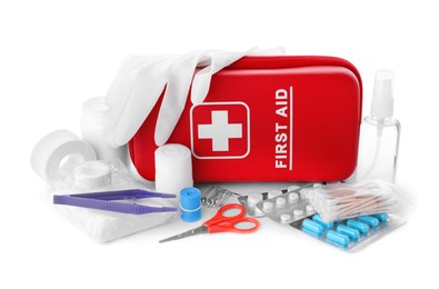 Photo of First aid kit, scissors, gloves, pills, cotton buds, plastic forceps, hand sanitizer and elastic bandage on white background. Health care