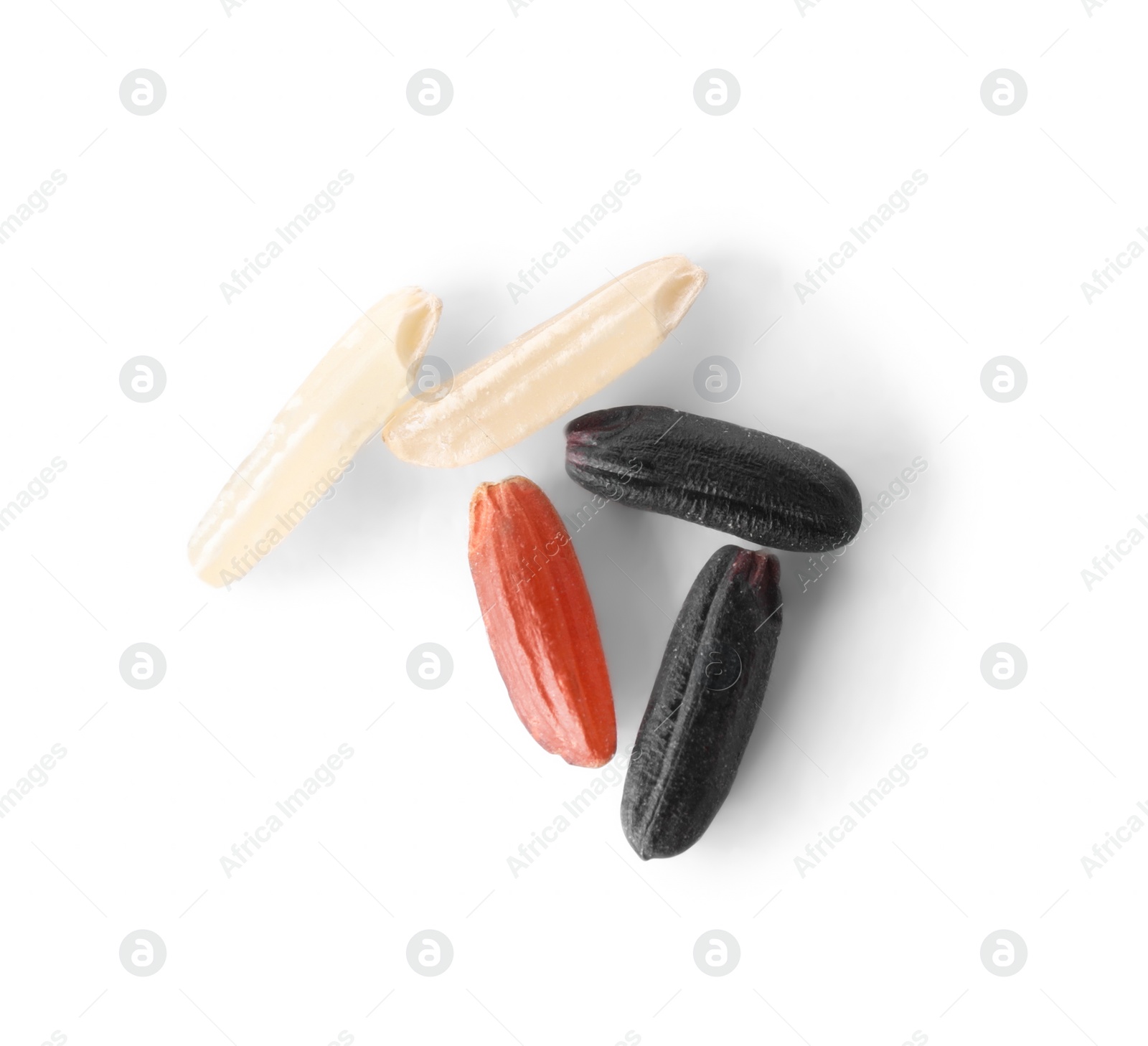 Photo of Different sorts of brown rice isolated on white, top view