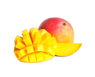 Photo of Delicious whole and cut mangoes on white background