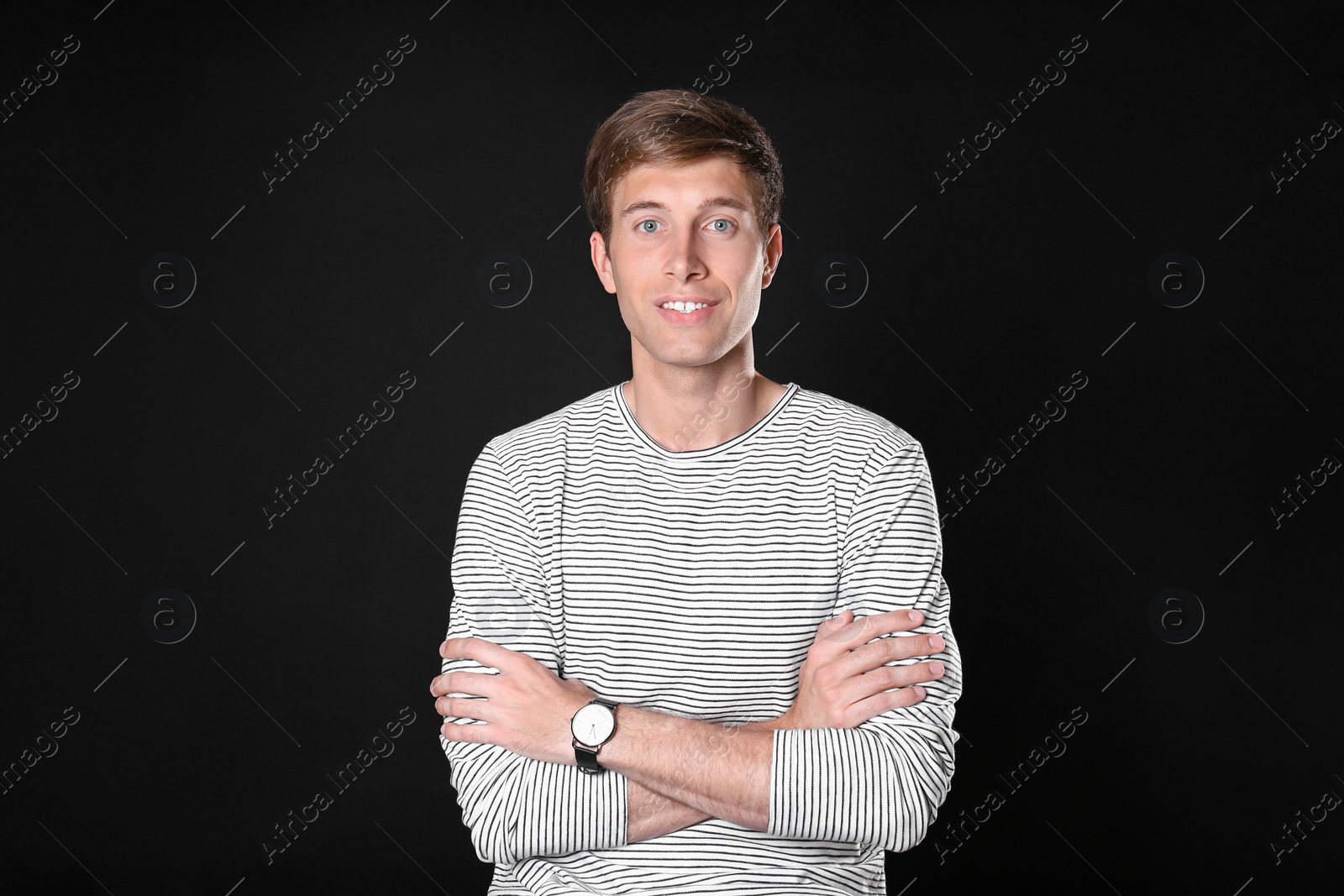 Photo of Portrait of handsome man on black background