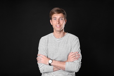 Photo of Portrait of handsome man on black background