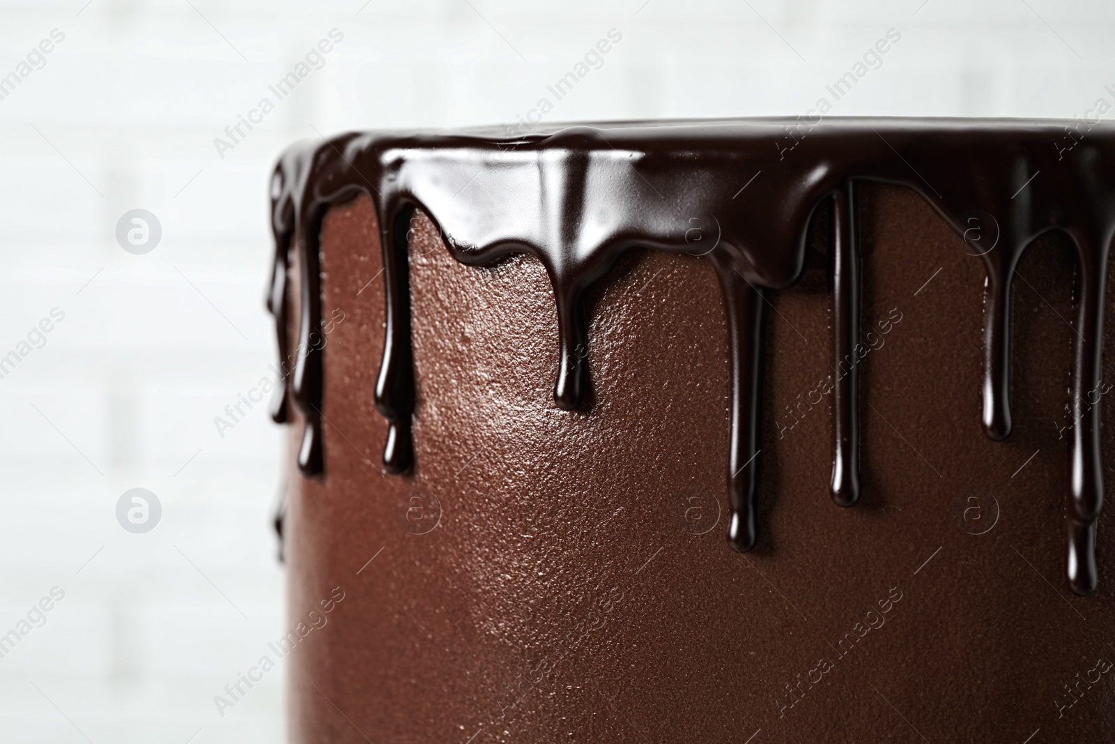 Photo of Freshly made delicious chocolate cake against white background, closeup