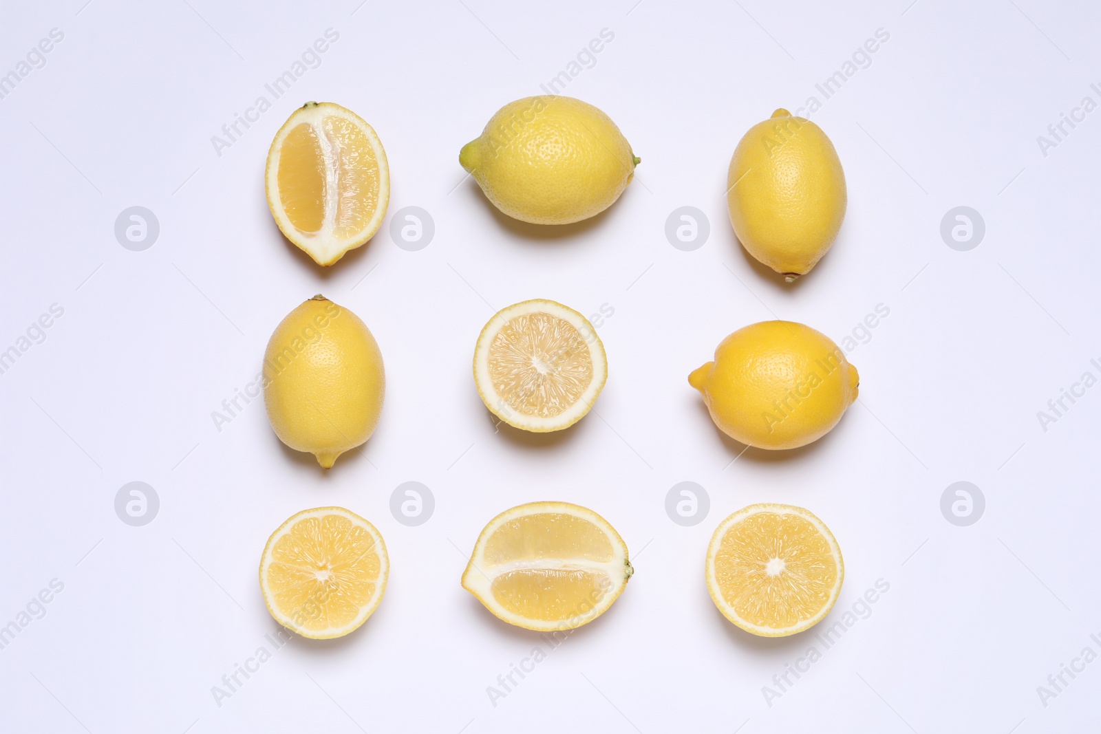 Photo of Many fresh ripe lemons on white background, top view