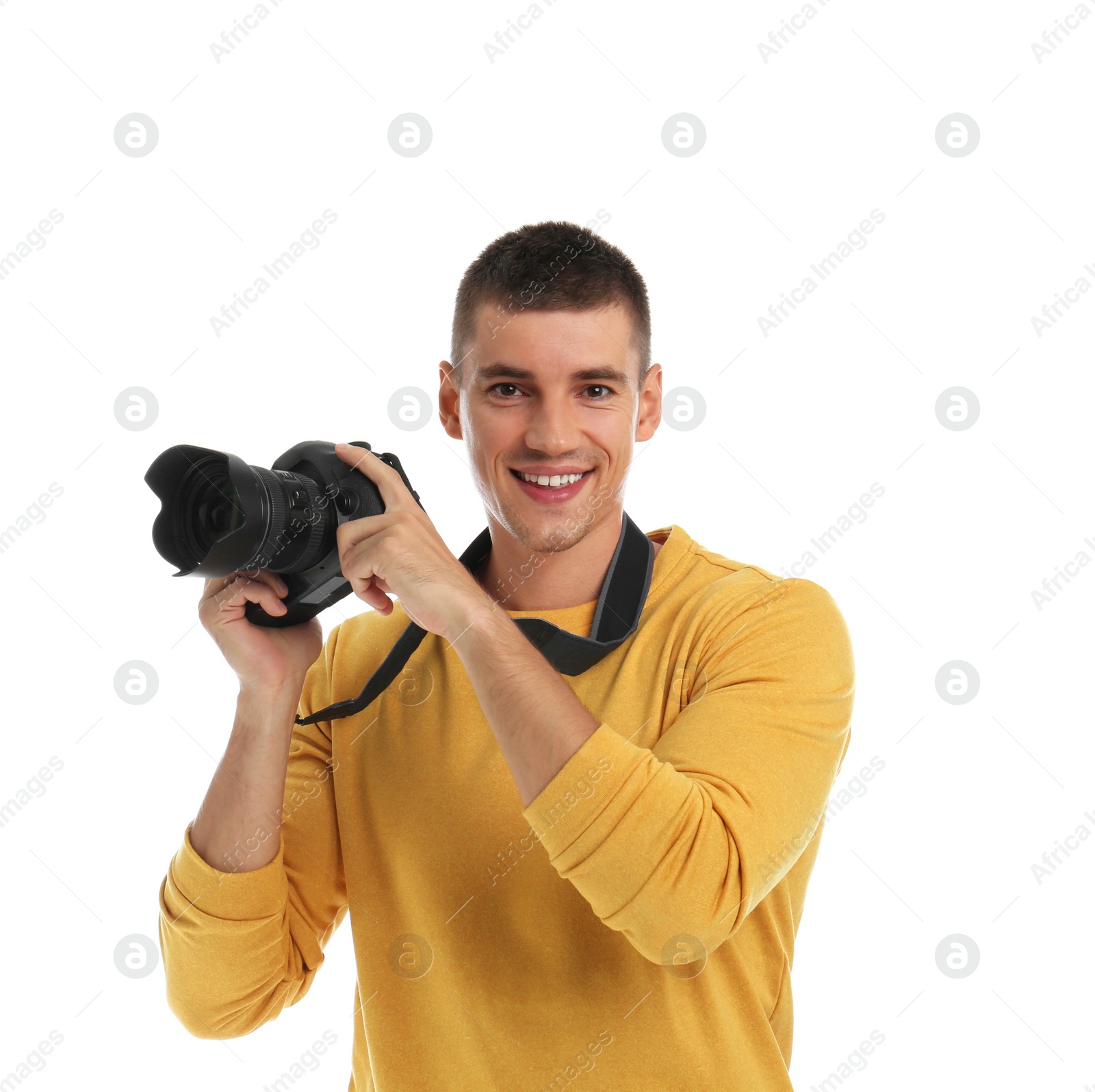 Photo of Young photographer with professional camera on white background