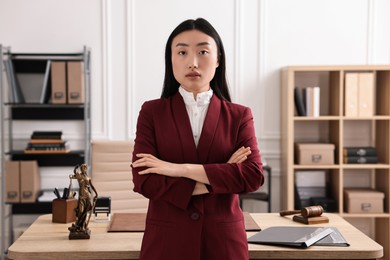 Photo of Portrait of notary with crossed arms in office