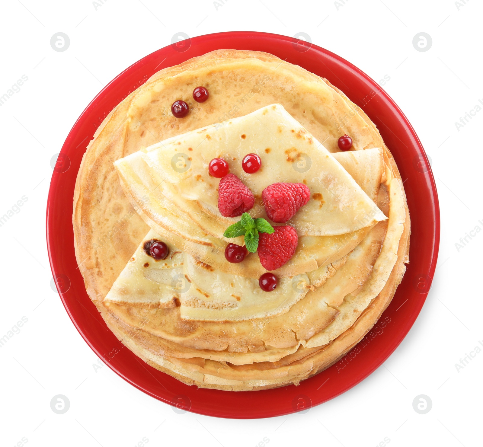 Photo of Delicious crepes with berries and mint on white background, top view