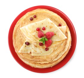 Photo of Delicious crepes with berries and mint on white background, top view