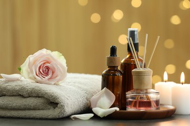 Photo of Composition with different spa products and rose flower on grey table