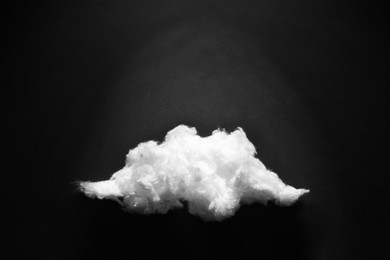 Cloud made of cotton on black background. Space for text