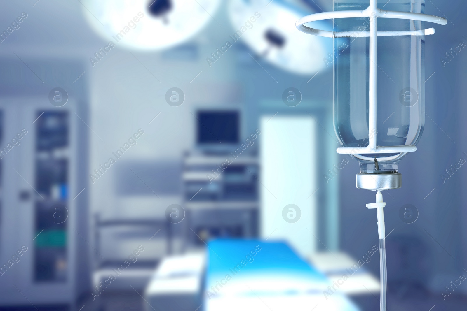 Image of Drop counter with bottle of medicine in operating room. Space for text