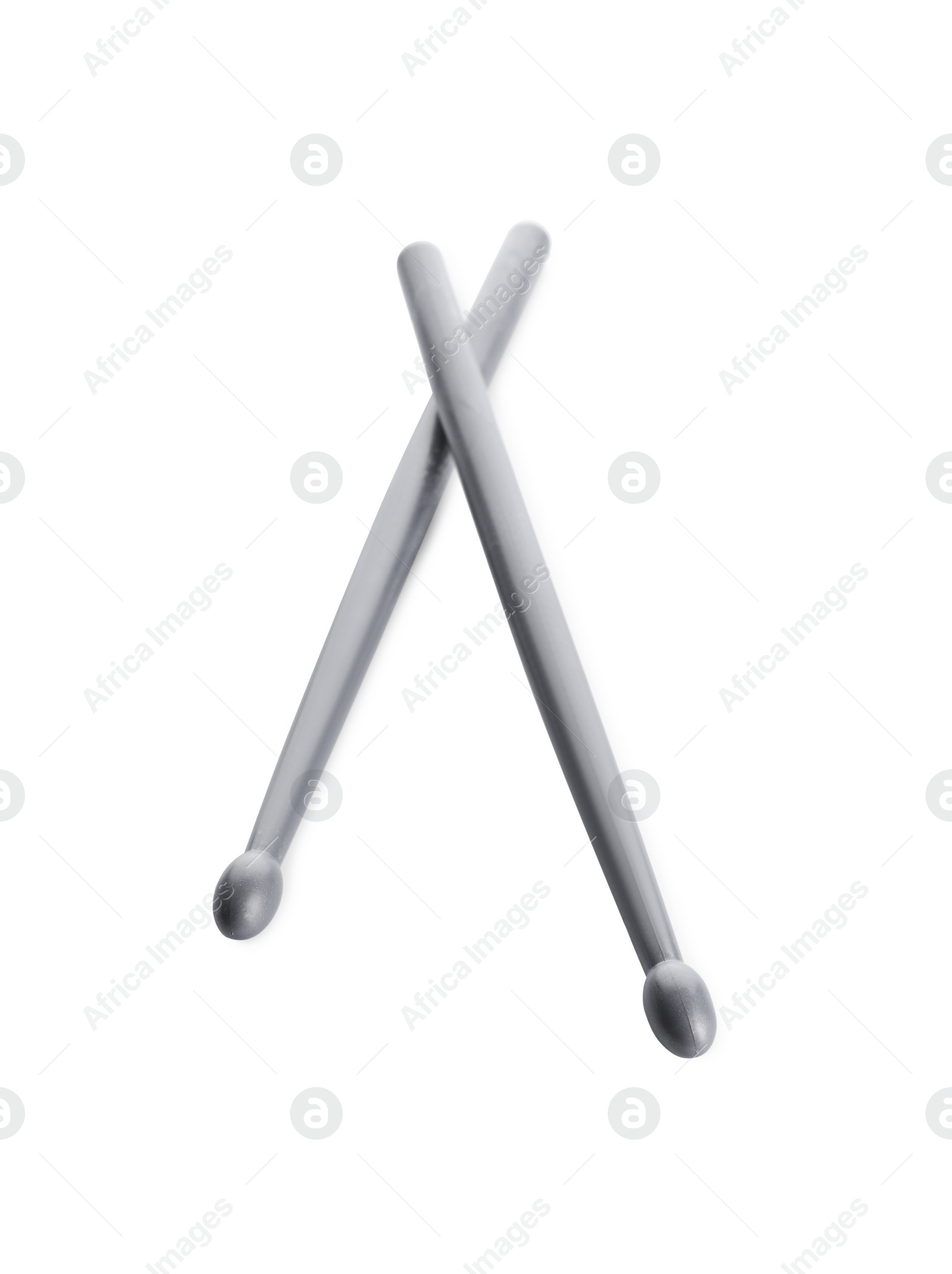 Photo of Two grey drum sticks isolated on white