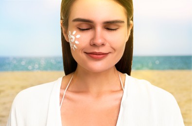 Image of Sun protection. Beautiful young woman with sunblock on her face near sea, closeup