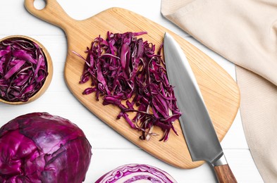 Photo of Fresh chopped red cabbage on white wooden table, flat lay