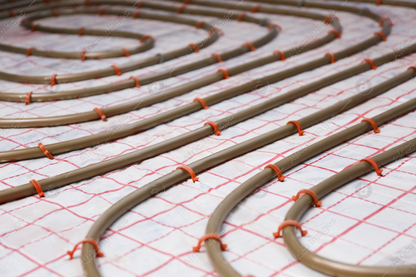 Photo of Installation of underfloor heating system in building