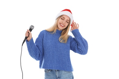 Photo of Emotional woman in Santa Claus hat with microphone on white background. Christmas music