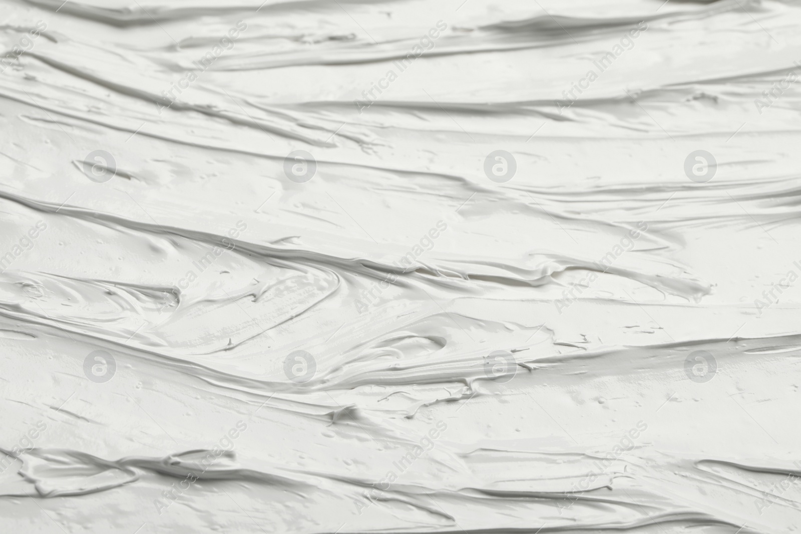 Photo of Texture of white oil paint as background, closeup