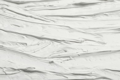 Texture of white oil paint as background, closeup